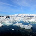 Scenic glacial lagoon with chunks of snow and ice.